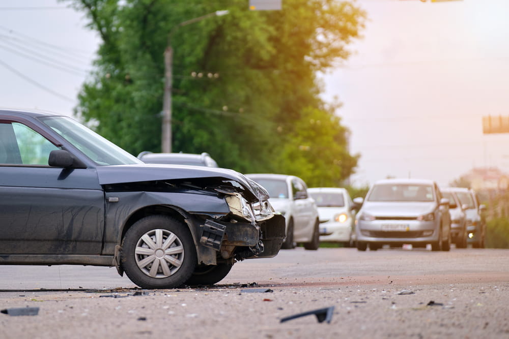 Damaged vehicle at the scene of a traffic accident